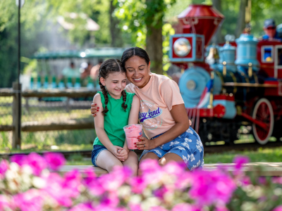 Mom and Daughter smiling at train