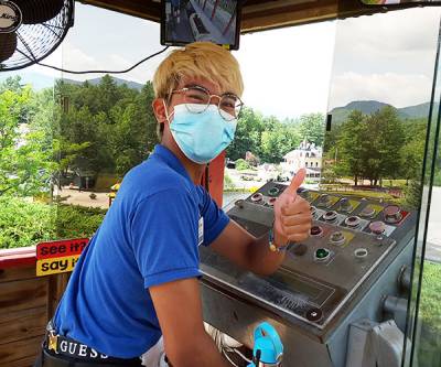 amusement park employee wearing a mask