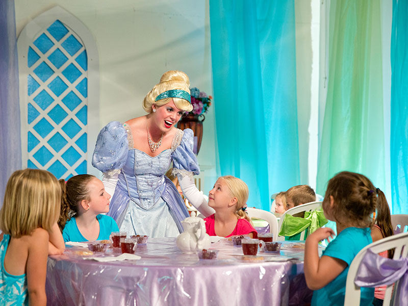 cinderella entertaining a group of little girls at storyland amusement park in new hampshire